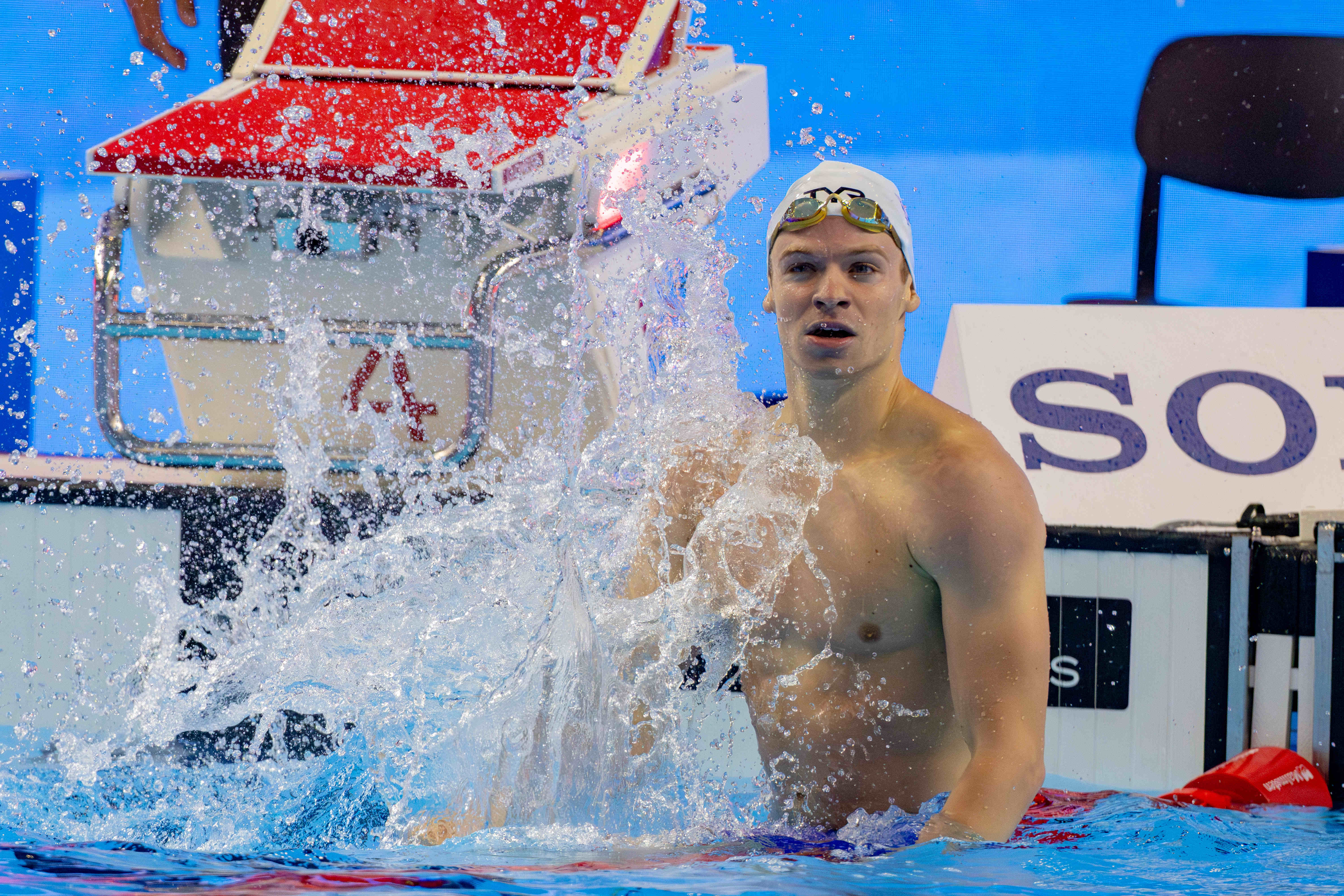 Leon Marchand celebrating after a world record swim in Singapore