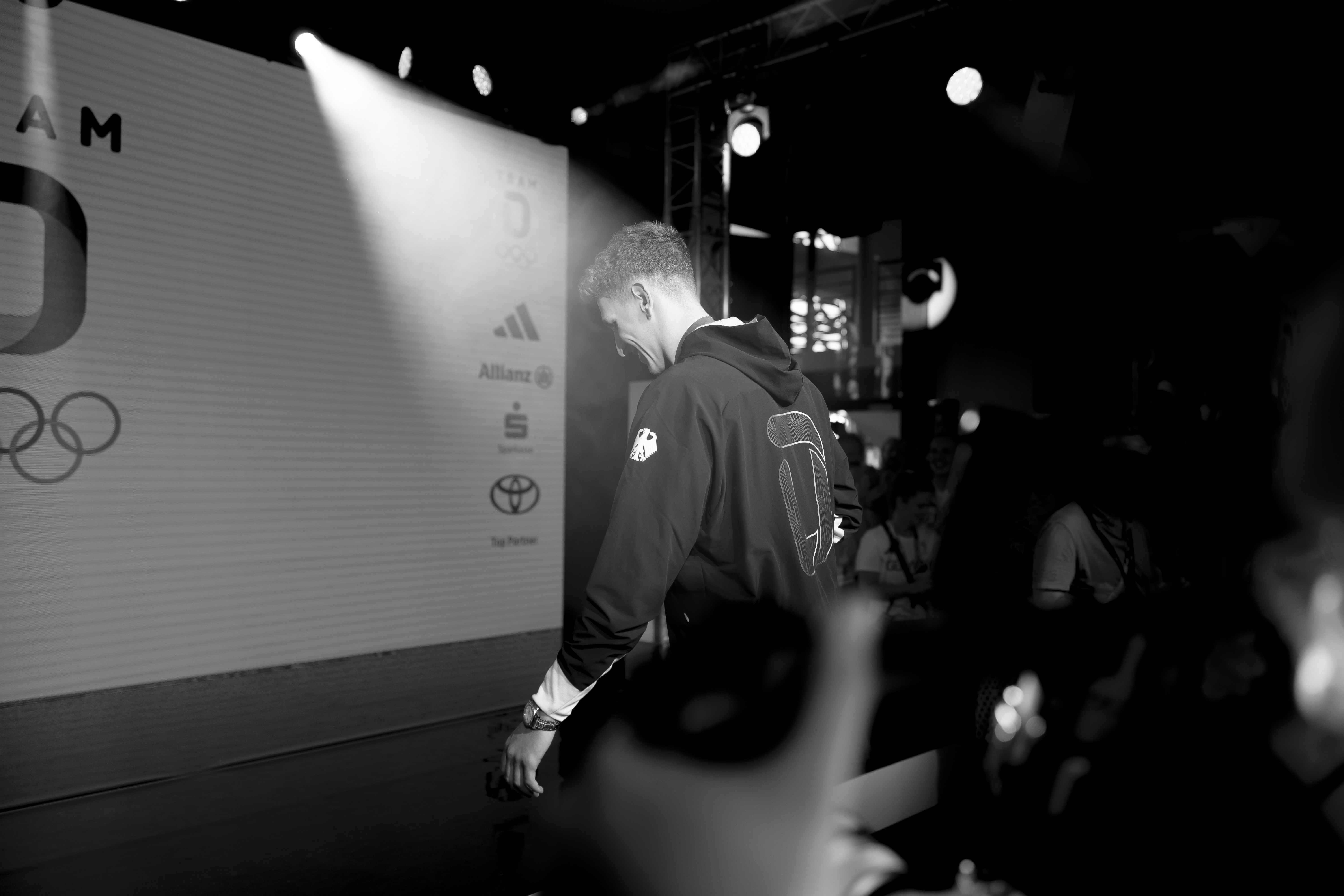 Lukas Maertens entering the stage during the medal celebration at the German House
