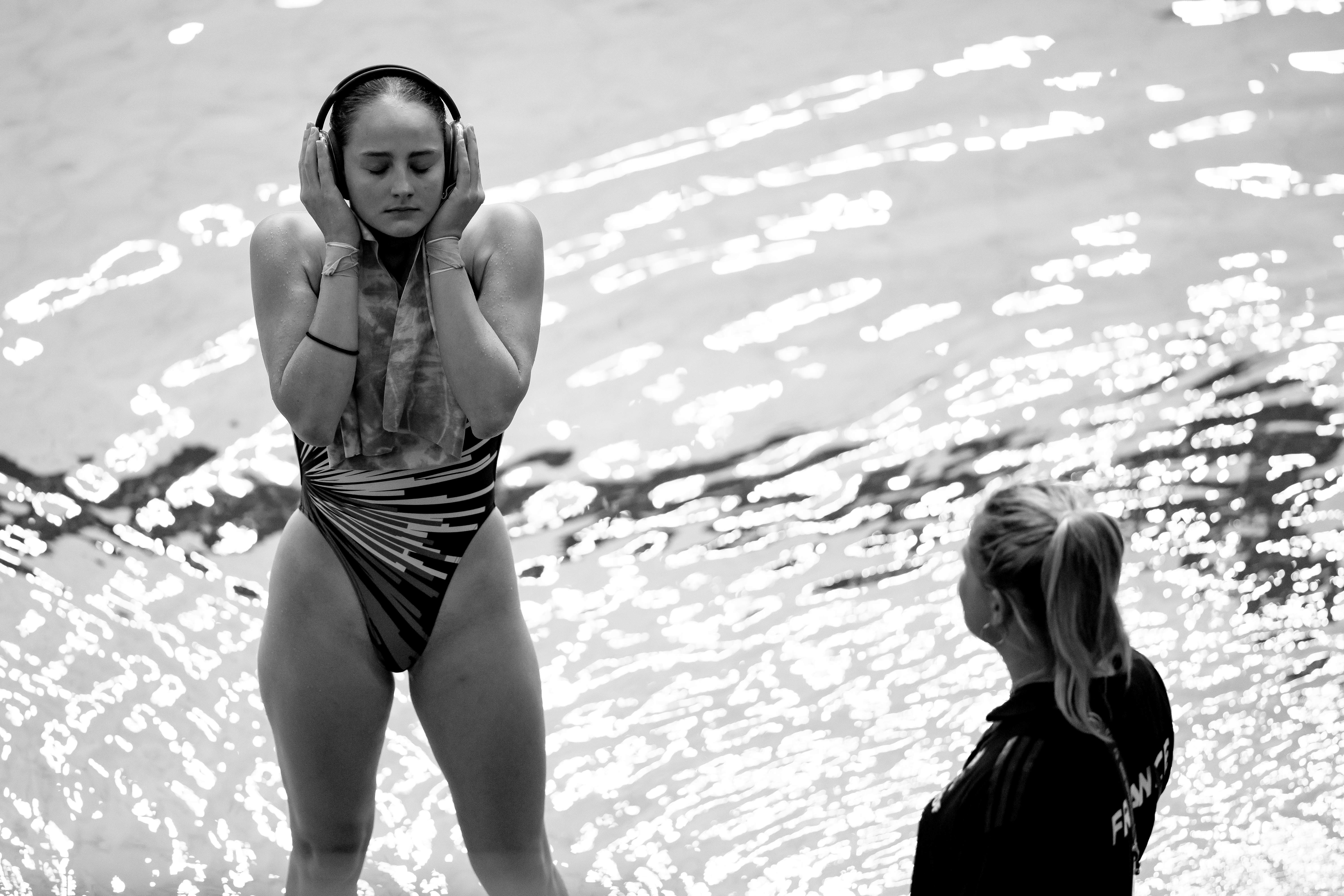 French diver preparing with headphones before competition in Singapore