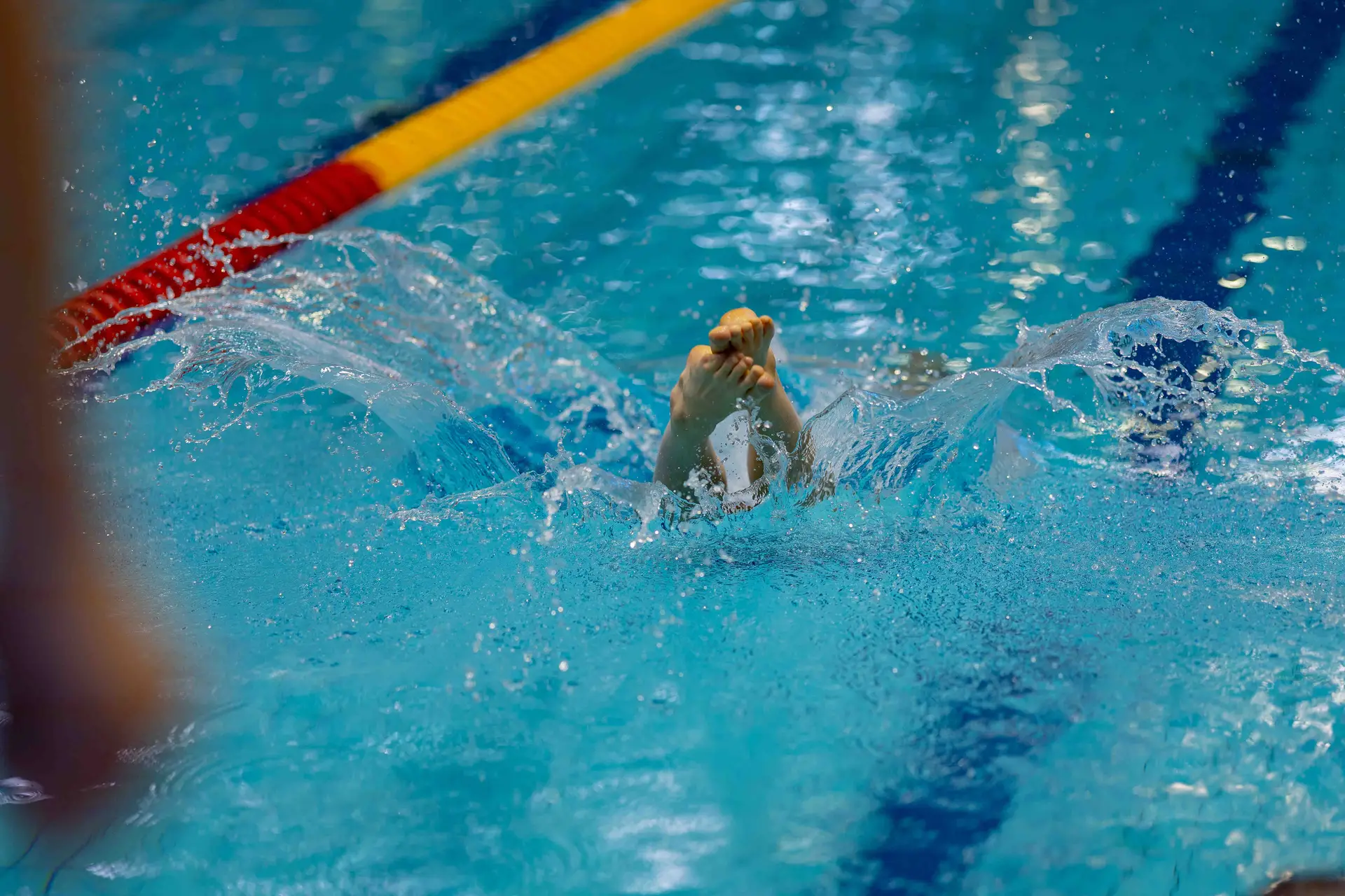 Feet entering the water
