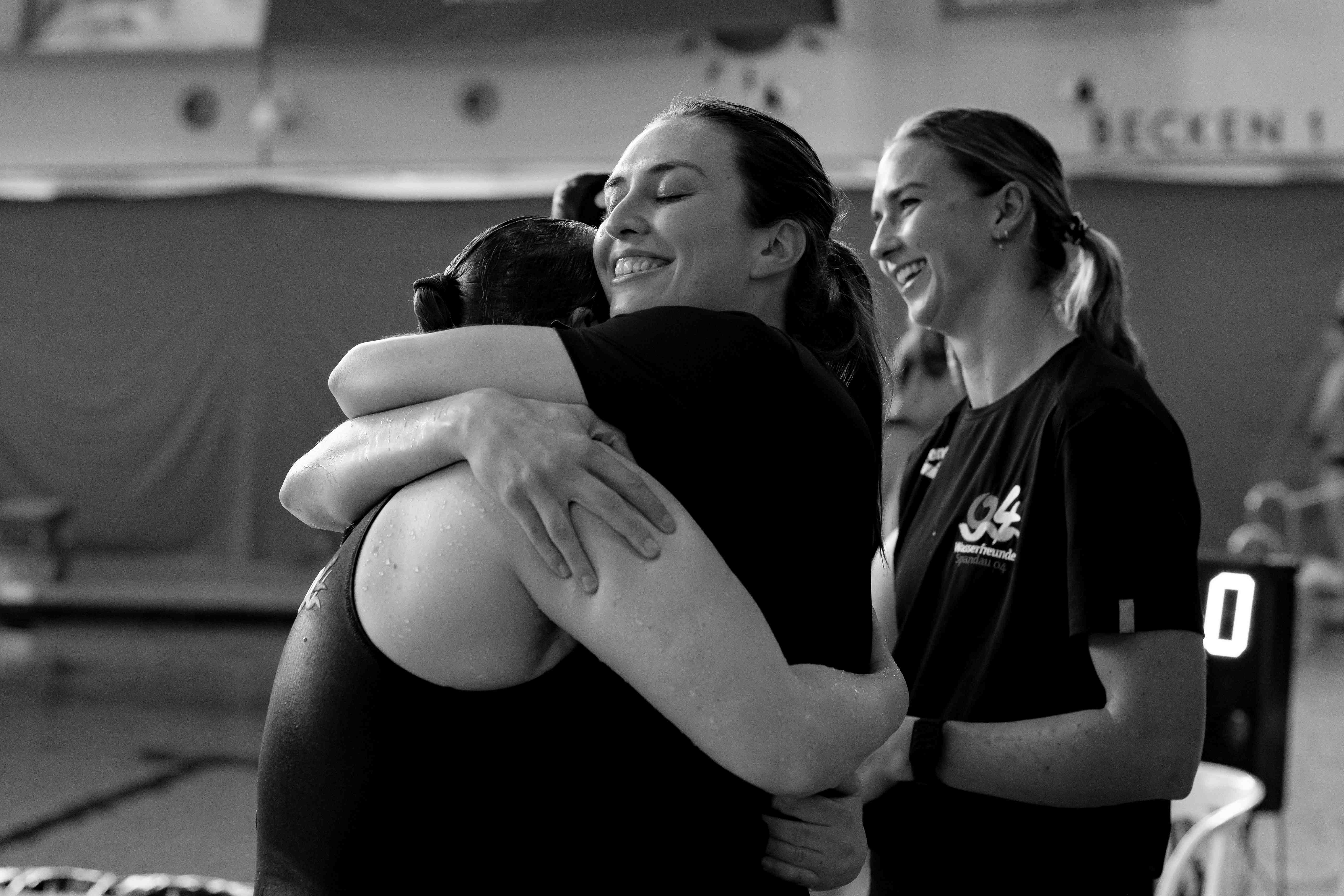 Water polo embrace after victory