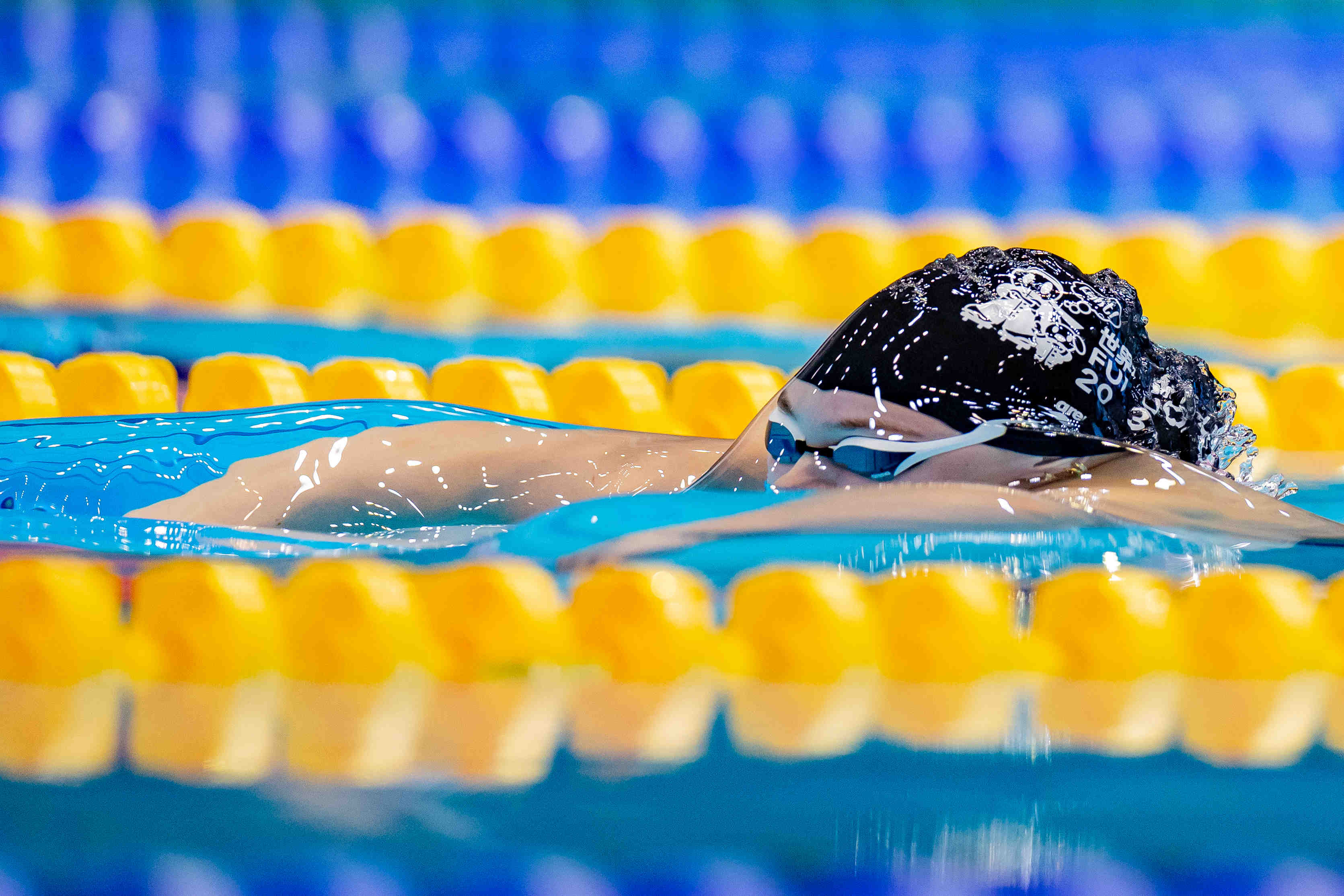 DJM athlete surfacing through water